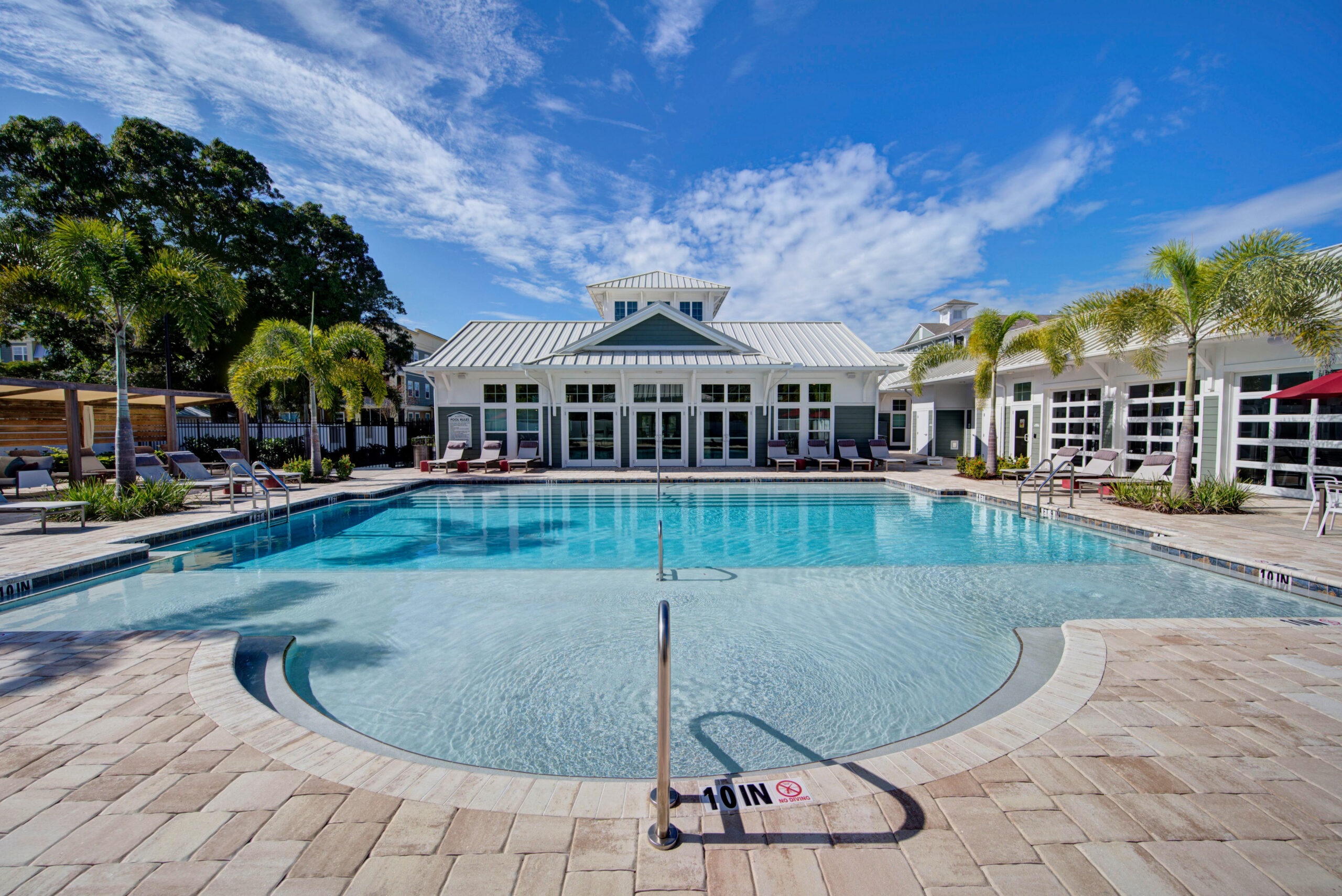 View of pool house and beautiful pool